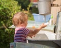 Boy washes his hands under washstand Royalty Free Stock Photo