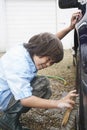 Boy Washing Car Wheel With Brush Royalty Free Stock Photo