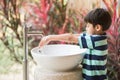 Boy washing hand at toilet park outdoor Royalty Free Stock Photo