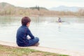 Boy watches how sportsmens kayaking