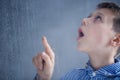 Boy watches rain Royalty Free Stock Photo