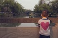 Boy watching boat leaving Royalty Free Stock Photo