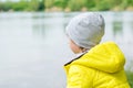 Boy is watching lake reflections Royalty Free Stock Photo