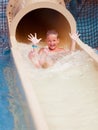 Boy on water slide Royalty Free Stock Photo