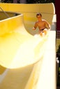 Boy on water slide Royalty Free Stock Photo