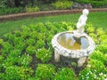 Boy water statue in the garden background Royalty Free Stock Photo