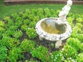 Boy water statue in the garden background Royalty Free Stock Photo