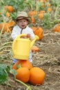 Boy with a Watering Can Royalty Free Stock Photo