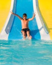 Boy on a waterslide. Royalty Free Stock Photo