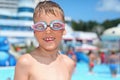 Boy in watersport goggles near pool in aquapark Royalty Free Stock Photo