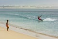 Boy wathing Kitesboarder Carlota beach Cape Verde
