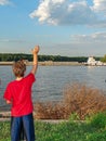 Boy Waving to a Barge on the Mississippi River