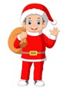 A boy wear santa costume carrying a sack