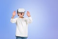 Boy wearing casual wear and vr googles touching metaverse realit Royalty Free Stock Photo