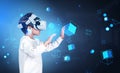 Boy wearing casual wear and vr headset touching metaverse realit Royalty Free Stock Photo