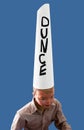 Boy wearing dunce cap Royalty Free Stock Photo