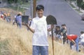 A boy wearing an Earth Day t-shirt participating in a tree planting by the Clean & Green volunteers of the Los Angeles