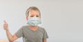 Boy wearing facial disposable mask. Stop coronavirus