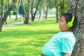 A boy wearing headphones to listen to music Royalty Free Stock Photo
