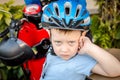 A boy wearing a helmet next to motorcycle Royalty Free Stock Photo