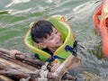 A boy wearing a life jacket to swim safely Royalty Free Stock Photo