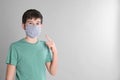 Boy wearing protective mask on light grey background, space for text. Child safety Royalty Free Stock Photo