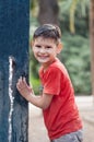 Boy with wet T-shirt. Playing with water. Water tap in the park. Royalty Free Stock Photo