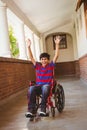 Boy in wheelchair in school corridor Royalty Free Stock Photo