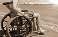 Boy on the wheelchair with vintage sepia toned effect