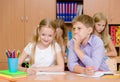 Boy whispering secrets of the girl in the classroom Royalty Free Stock Photo