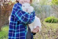 Boy with white bunny in his hands, child with decorative rabbit Royalty Free Stock Photo