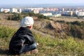 A boy in a white cap is looking on city Royalty Free Stock Photo