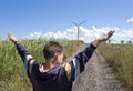 Boy and wind turbine Royalty Free Stock Photo