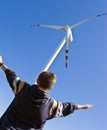 Boy and wind turbine Royalty Free Stock Photo