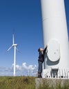 Boy and wind turbine Royalty Free Stock Photo