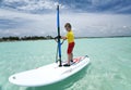 Boy on windsurfing board. Royalty Free Stock Photo