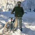 Boy with winter bike