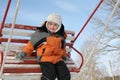 Boy on winter seesaw Royalty Free Stock Photo