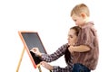 A boy, woman and blackboard.Writing Royalty Free Stock Photo