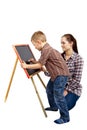 A boy, woman and blackboard.Writing Royalty Free Stock Photo