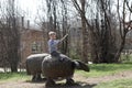 Boy on a wooden sheep