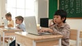 Boy working on his laptop while learning about coding prompt at class. Pedagogy. Royalty Free Stock Photo