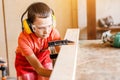 Boy in the workshop independently learns to work Royalty Free Stock Photo