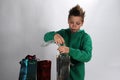 Boy wrapping up christmas gifts