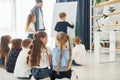 Boy writing on the board. Group of children students in class at school with teacher Royalty Free Stock Photo