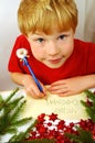 Boy writing Christmas wishes Royalty Free Stock Photo