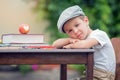 Boy, writing his homework from school, drawing and writing in hi Royalty Free Stock Photo