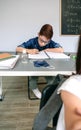 Boy writing in his notebook at school Royalty Free Stock Photo