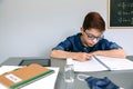 Boy writing in his notebook at school Royalty Free Stock Photo