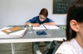 Boy writing in his notebook at school Royalty Free Stock Photo